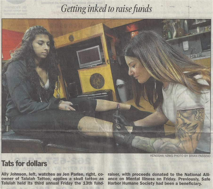 Newspaper article showing Ally Johnson getting a leg tattoo from Jen Parise